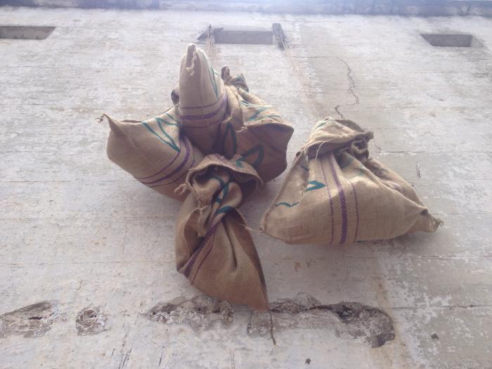 Six and Fours: Prison Anxieties, 2013, jute rope, jute sack, found material, metal scaffold, dimensions variable